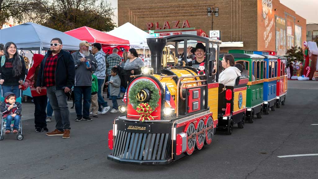 Wattman Mini Express trackless train carrying happy passengers at a US attraction