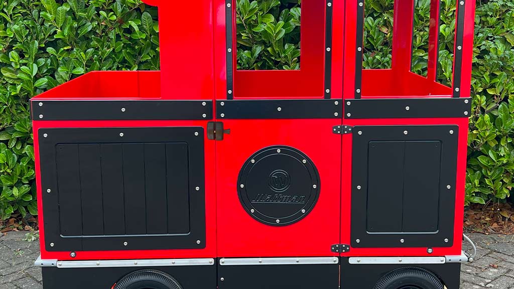 Advertising panels on Wattman train passenger wagons with custom branding