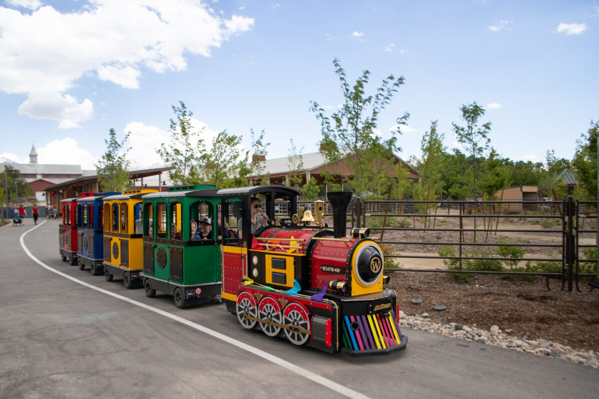 Wattman electric trackless train at Thanksgiving Point in Lehi, Utah — family attraction at a U.S. park