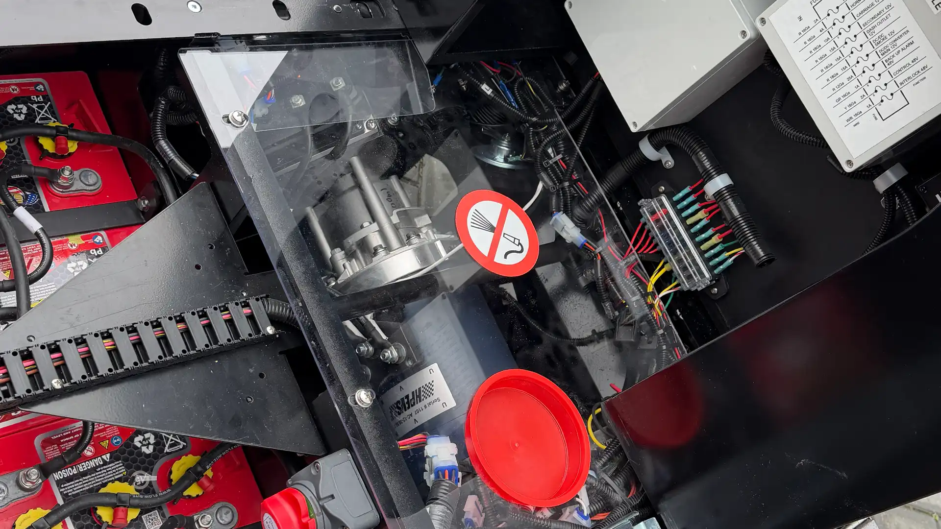 Wattman Maxi Express electric trackless train in outdoor operation — full passenger capacity at a U.S. park or attraction