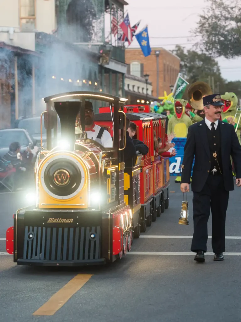 Wattman Mini Express trackless train at U.S. venue — side view showing locomotive and wagons