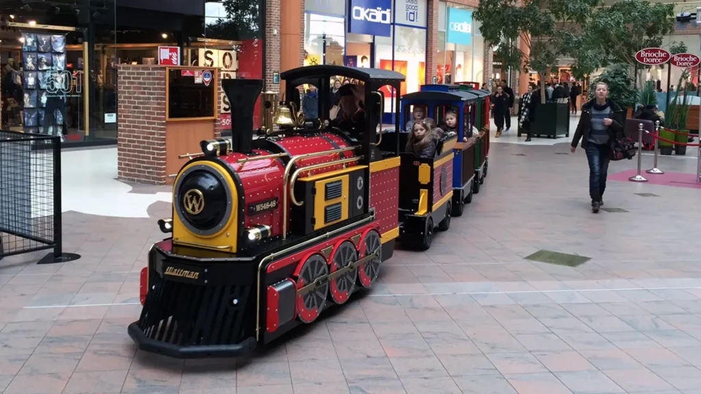 Wattman Mini Express electric trackless train in operation inside a U.S. shopping mall