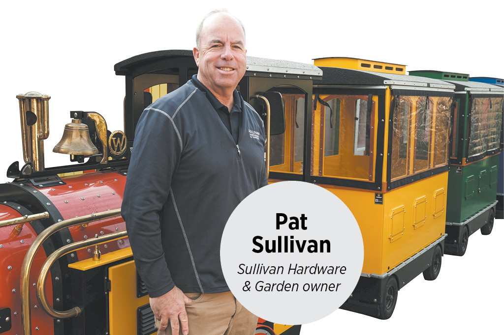 Pat Sullivan, owner of Sullivan Hardware and Garden, with the Sullivan Express Wattman Maxi Express trackless train in Indianapolis Indiana